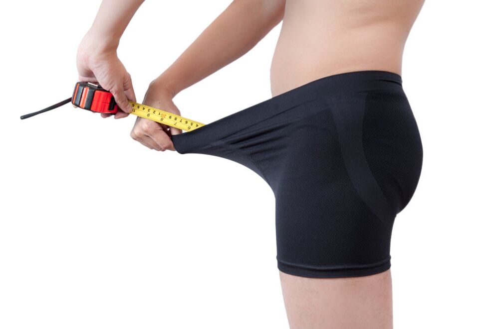 A man measures the results of his penis enlargement