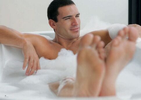 a man takes a bath with baking soda to enlarge his penis